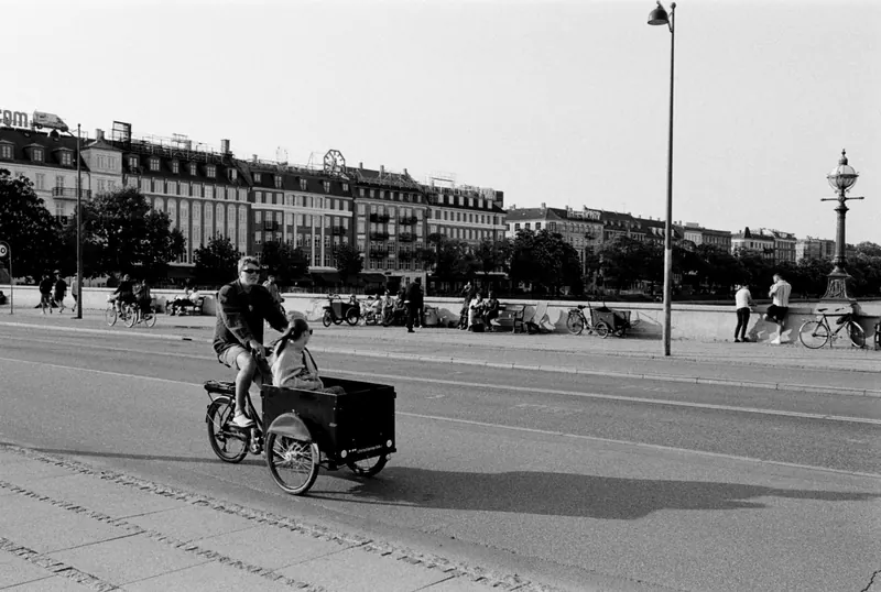 Black and white scene of a cyclist in Copenhagen street